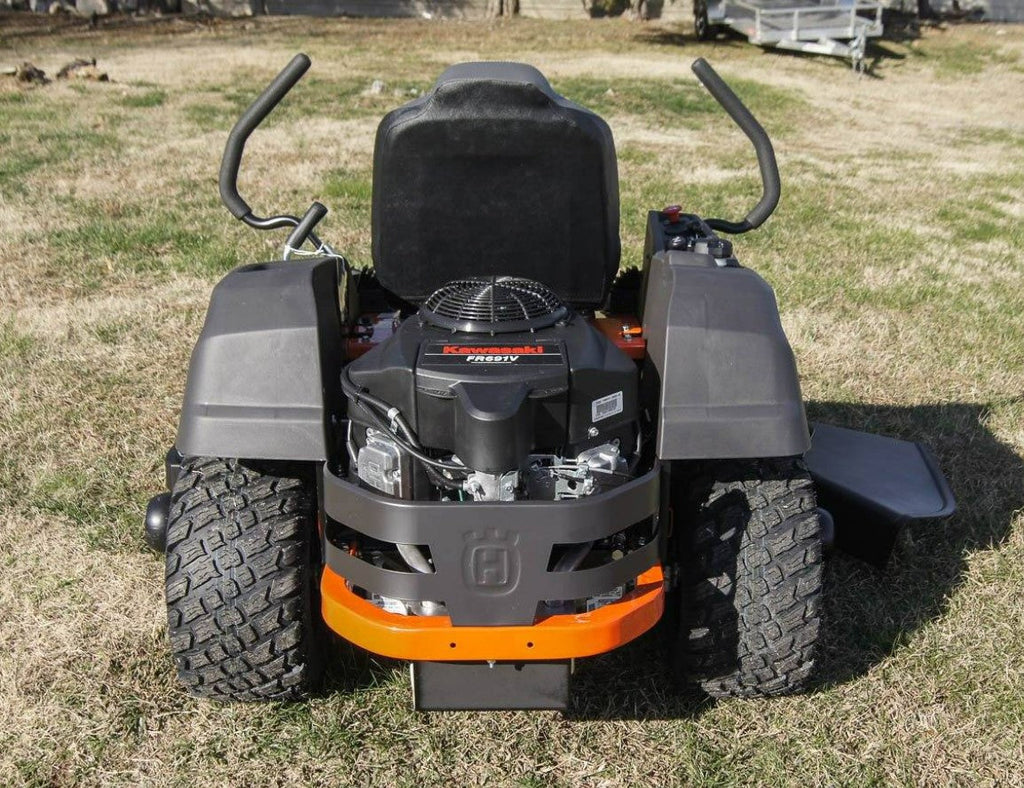 Mower on a grassy field with visible Husqvarna logo