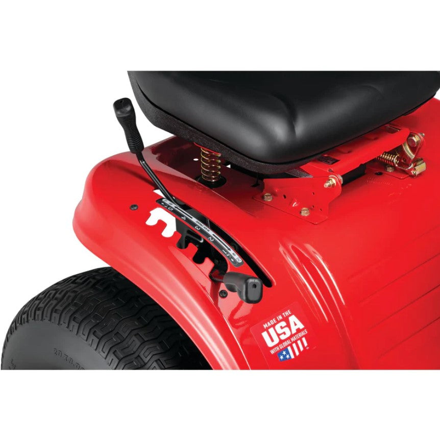 Close-up of a red riding lawn mower with a black seat and 'Made in the USA' label.