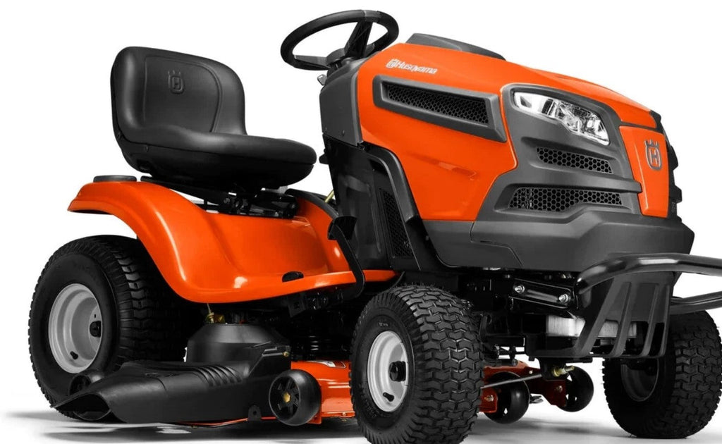 Orange and black lawn mower on a white background