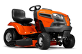 Orange and black riding lawn mower on a white background